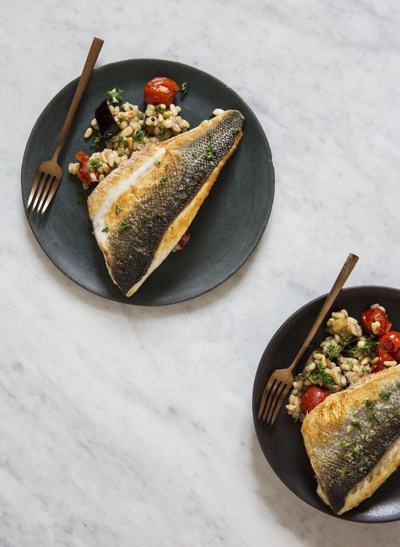 Sea bass with tomato, aubergine and pearl barley
