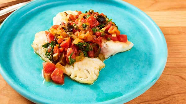 Sea bass with tomato, olives, and capers