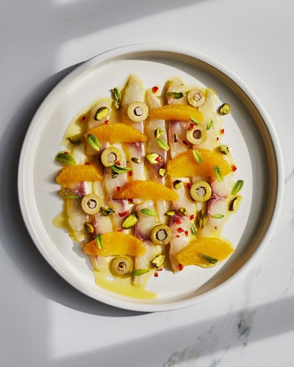 Sea bream crudo with orange, chilli, olive, pistachio and mint
