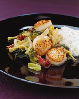 Sea scallops with ham-braised cabbage and kale