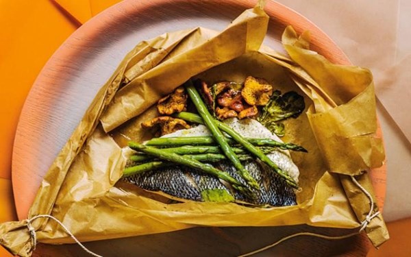 Seabass with spring vegetables and vermouth en papillote