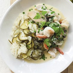 Seafood with herbs and cream on lemon and zucchini pilaf