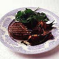 Seared Aberdeen Angus beef fillet with oven-roasted onions and watercress salad