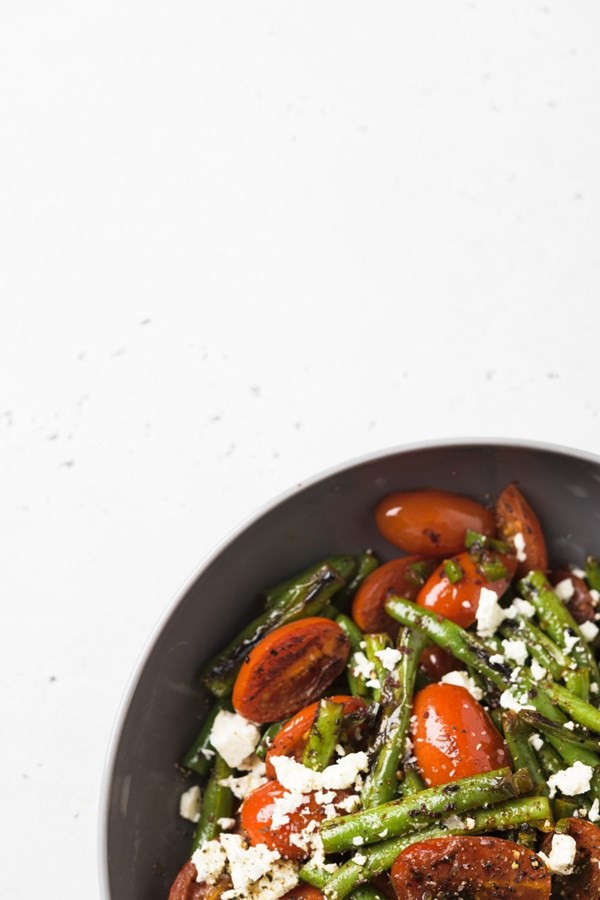 Seared and steamed green beans and tomatoes with feta