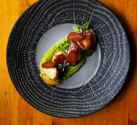 Seared bay scallops with pea purée and radishes