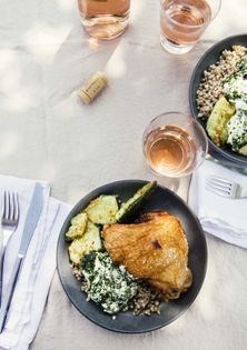 Seared chicken thighs w/buckwheat, smashed cucumbers + Tajín oil