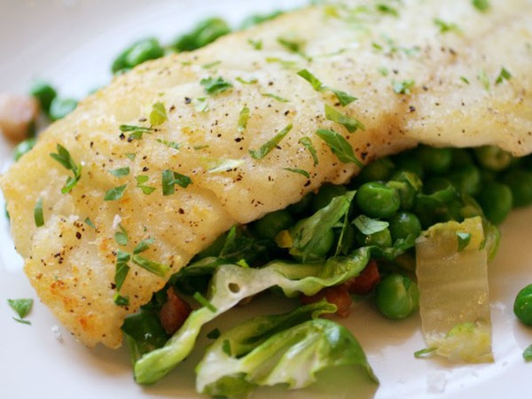 Seared cod with peas, pancetta, and wilted lettuce