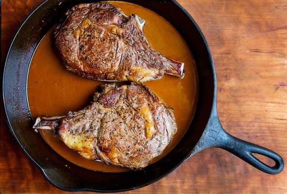 Seared cowboy steaks with Guinness sauce