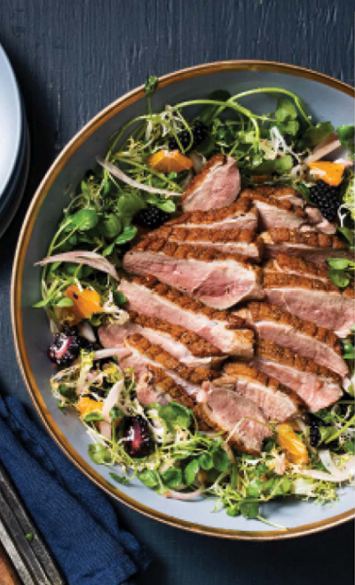 Seared duck breast with orange and blackberry salad