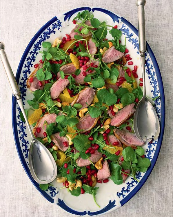 Seared duck breast with watercress, cashews and pomegranate