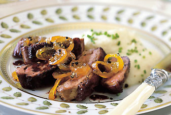 Seared duck breasts with red-wine sauce and candied kumquats