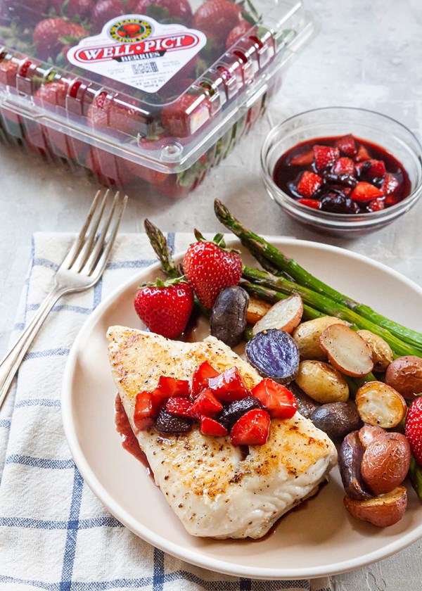 Seared halibut with berry compote and roasted vegetables