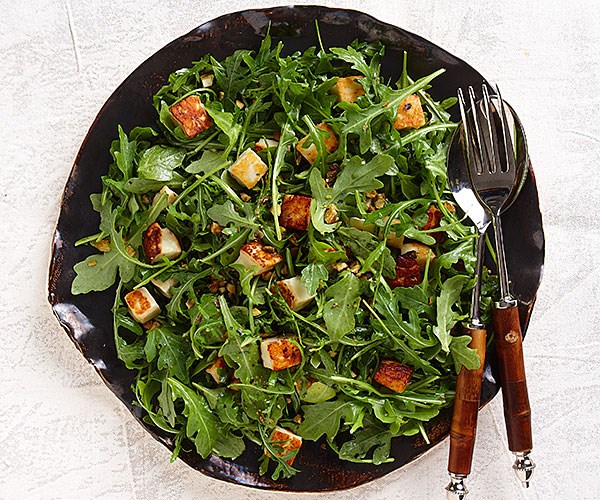 Seared halloumi with arugula, capers, and pistachios