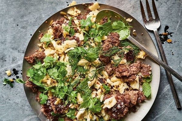 Seared lamb patty with marinated haloumi and herbs