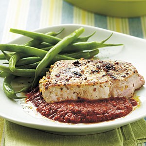 Seared pork chops with spicy roasted pepper sauce