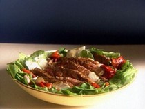 Seared rib-eye steak with arugula-roasted pepper salad