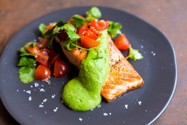 Seared salmon with avocado sauce and tomato-cilantro salsa