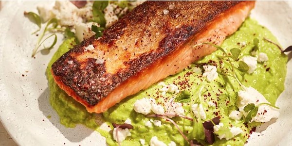 Seared salmon with pea purée