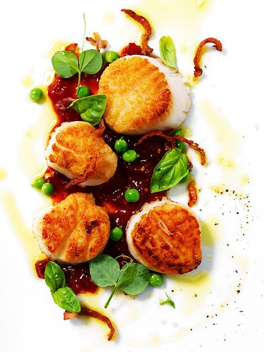 Seared scallops, tomato-chile jam, fresh peas, and bacon