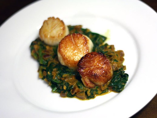 Seared scallops with Indian spinach