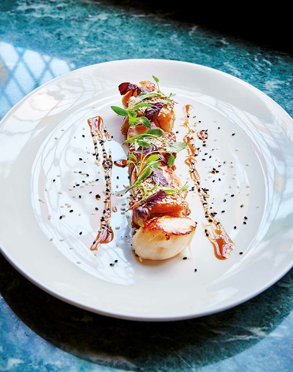 Seared scallops with sesame pork, XO Dressing and shiso