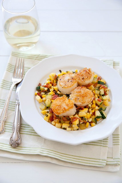 Seared scallops with summer veggie and bacon hash