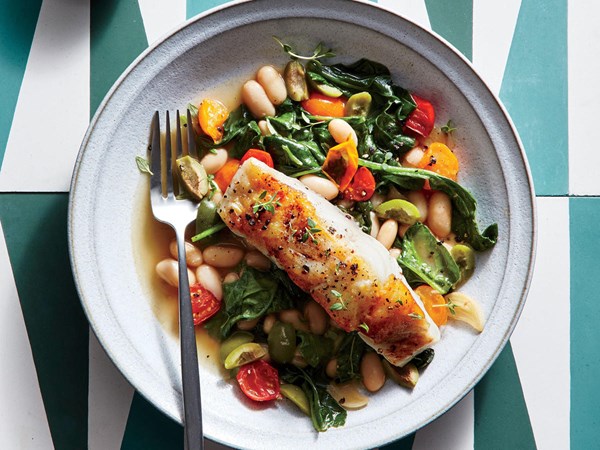 Seared sea bass with lemon-olive white beans