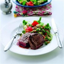 Seared steak with white beans and watercress