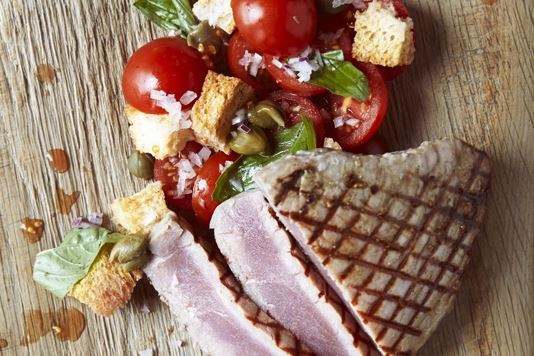 Seared tuna fillet, cherry tomatoes, capers, red onion, basil, croutons