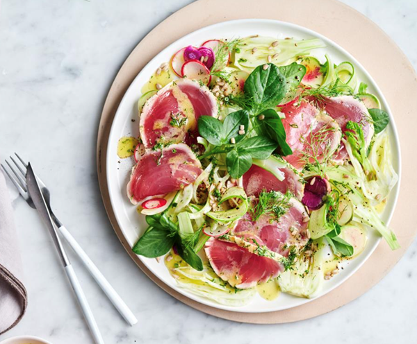 Seared tuna with baby spring greens