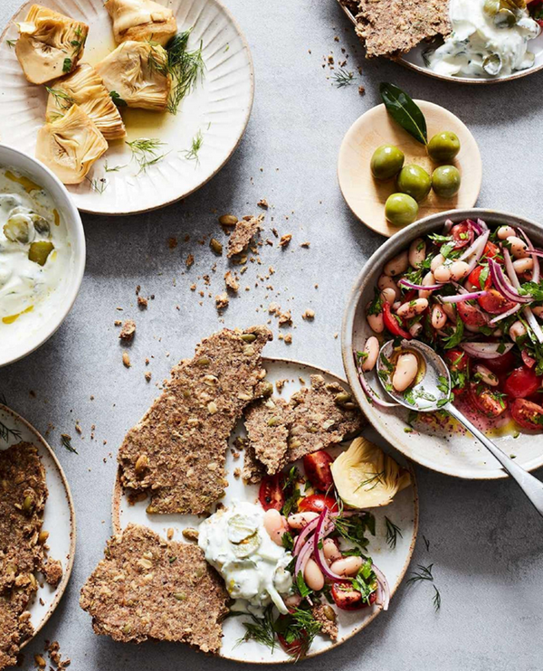 Seedy rye and oat crispbreads with piyaz and simple pickled cucumber tzatziki