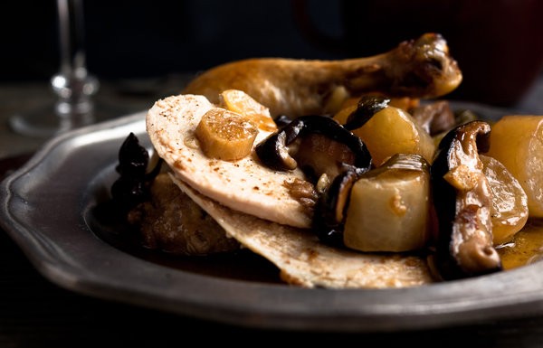 Sesame braised chicken in a pot with shiitake, daikon and ginger