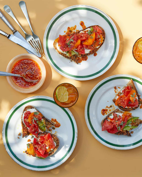 Sesame-harissa salsa on grilled tomato toasts