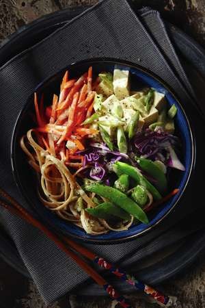 Sesame noodles with Thai green curry tofu, red cabbage, and snap peas