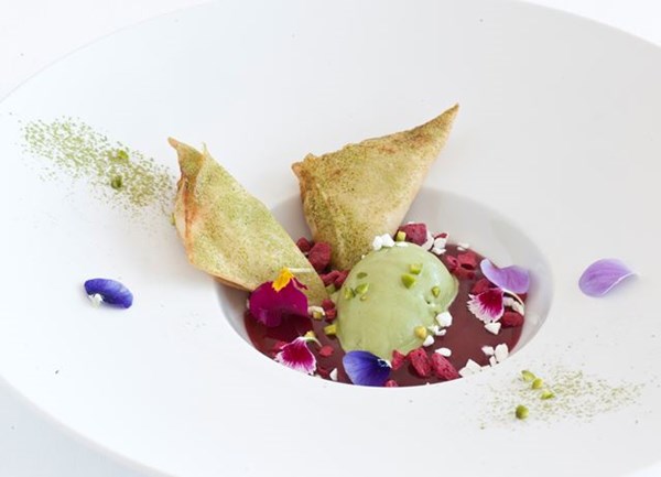 Sfogliatelle samosas with green tea ice cream and berry sauce