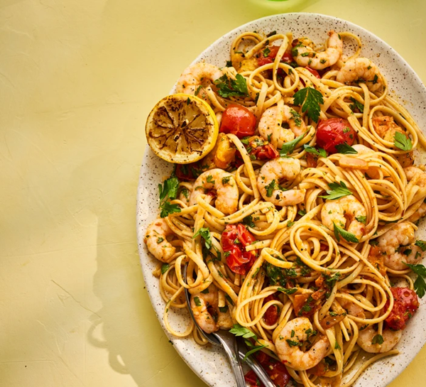 Sharing platter linguine with prawn pil pil, the best burst tomatoes & charred lemon