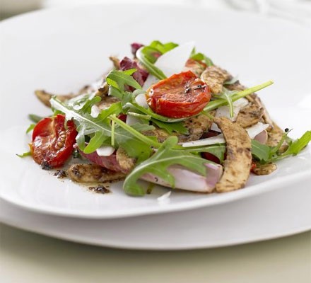 Shaved artichoke with tomatoes, anchovy and olive dressing
