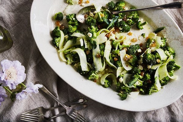 Shaved broccoli stalk salad with soft feta & golden raisins