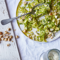 Shaved Brussels sprout salad with blue cheese and crushed hazelnuts