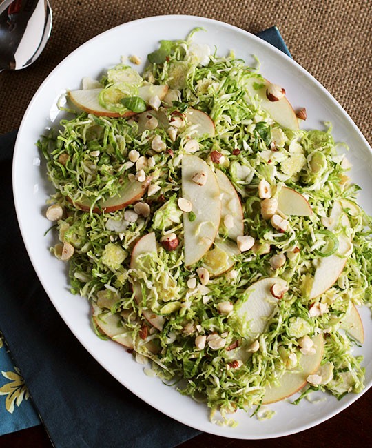 Shaved Brussels sprouts salad with apples, hazelnuts & brown butter dressing