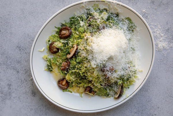 Shaved Brussels sprouts with roasted mushrooms, Manchego and maple dressing