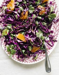 Shaved cabbage salad with chili oil, cilantro, and charred melon
