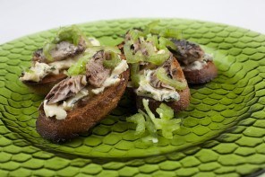 Shaved celery and sardines on blue cheese toast
