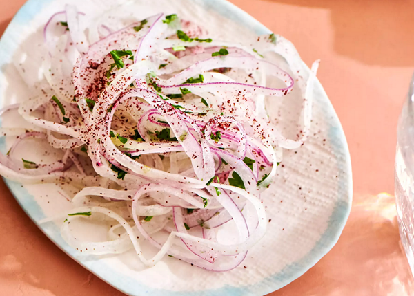 Shaved onions with sumac and parsley