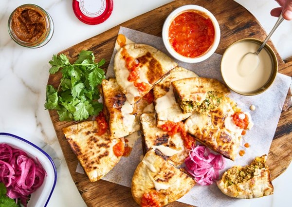 Shawarma arayes with shatta and tomato dipping sauce