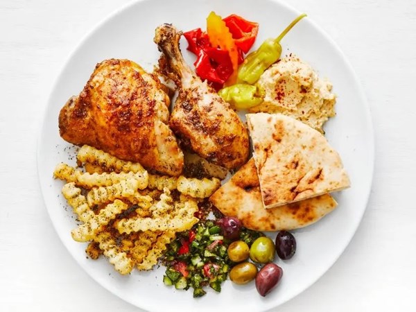 Shawarma-spiced chicken legs with za’atar fries 
