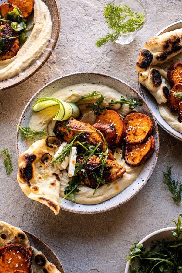 Sheet pan chicken shawarma with sesame sweet potatoes and hummus
