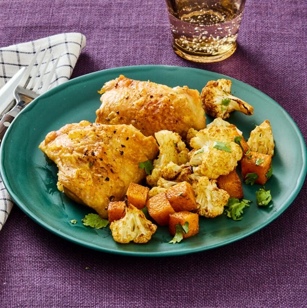 Sheet-pan chicken thighs with butternut squash and cauliflower