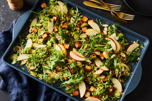 Sheet-pan miso tofu with Brussels sprouts, apple & arugula