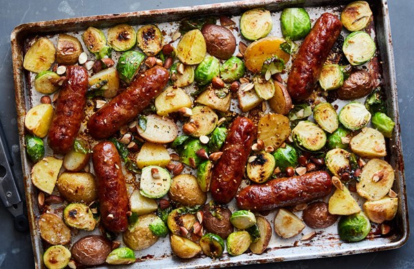 Sheet-pan sausage and Brussels sprouts with honey mustard [Ali Slagle]